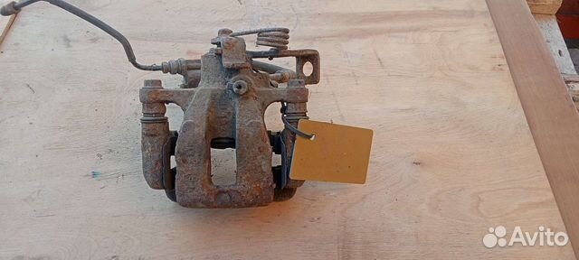 Суппорт тормозной задний правый Киа Рио 3 Kia Rio