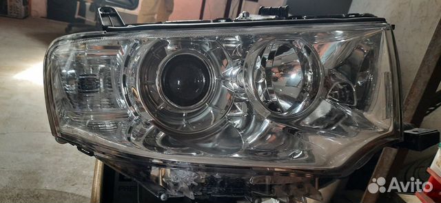 Фара левая mitsubishi Pajero Sport 09) / L200 05-1